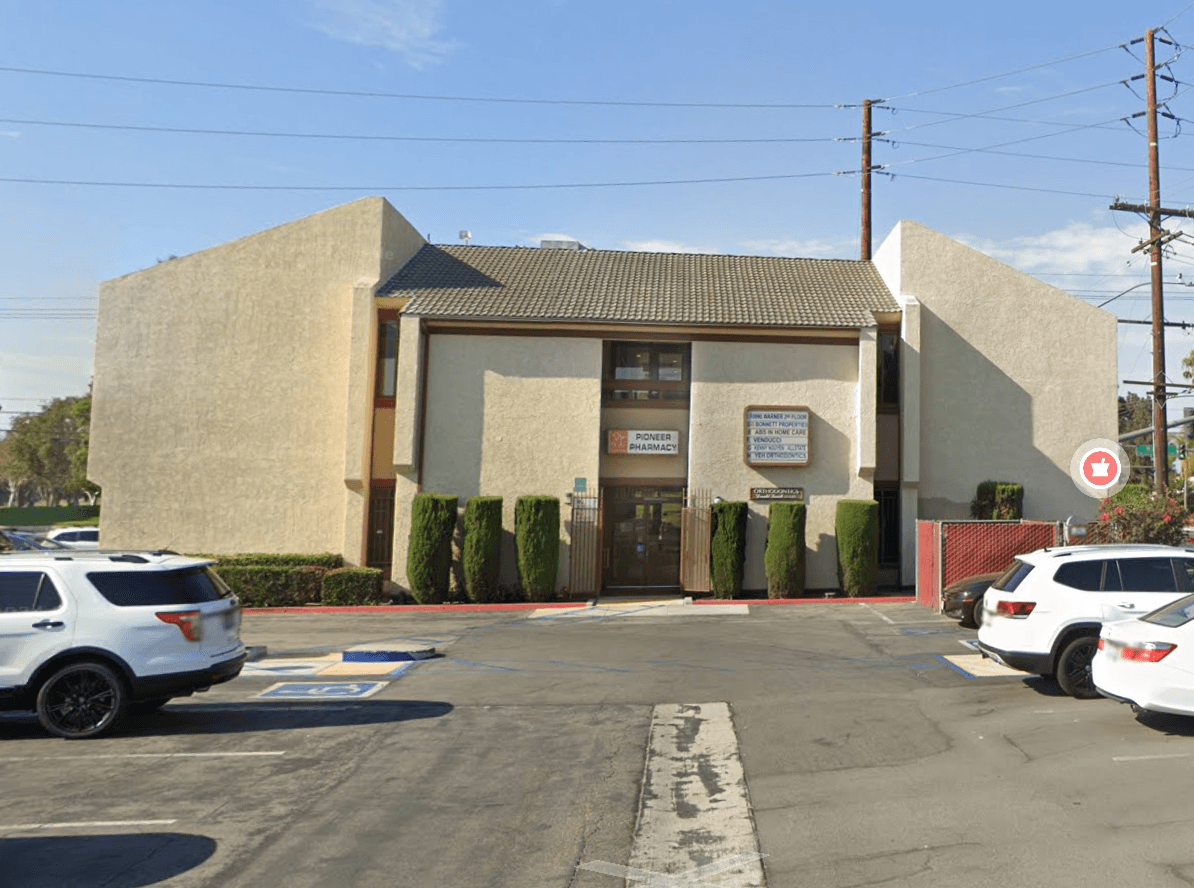 South entrance of 10990 Warner Avenue, viewed from the plaza parking lot